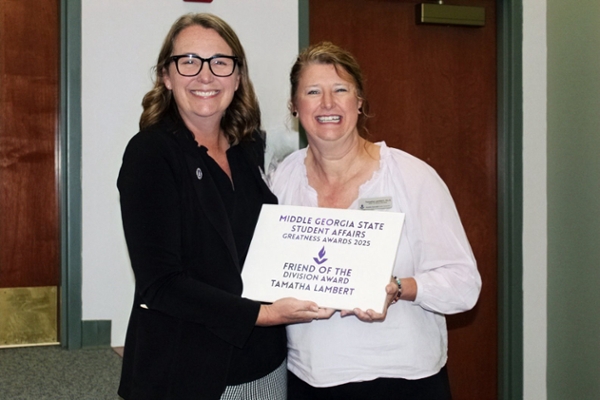 Tamatha Lambert wins "Friend of the Division Award" at Greatness Awards.